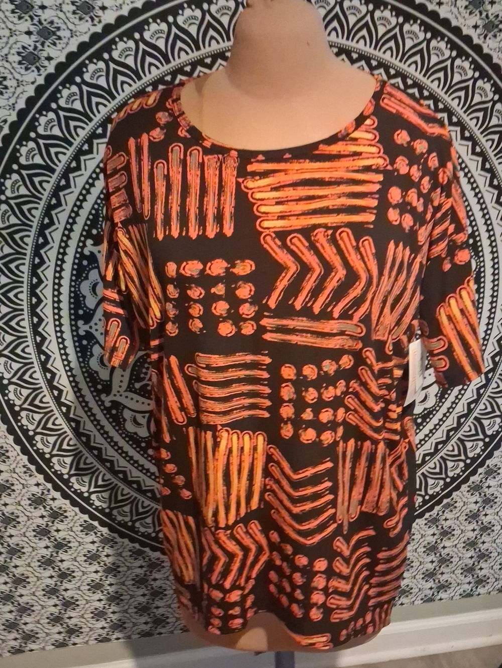 LuLaRoe Black Tee with Orange Abstract Geometric Print